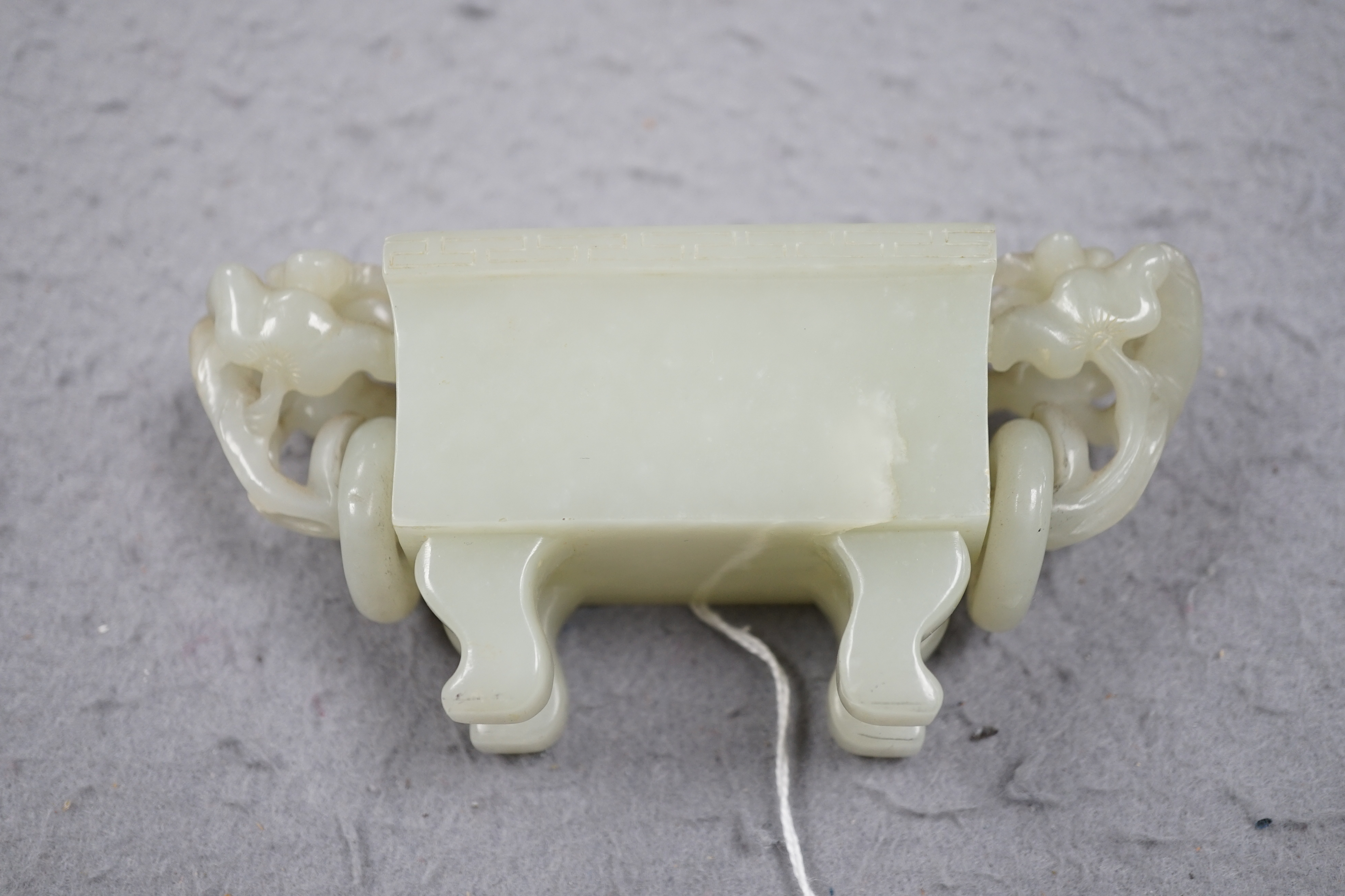 A Chinese pale celadon jade rectangular vase and cover, 19th/20th century